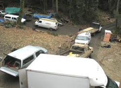 A crowd of work vehicles in the driveway in early February